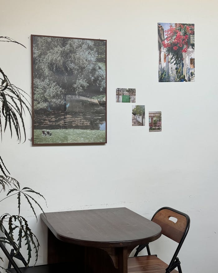 about-me-02 Cozy interior with wall art and a wooden table hinting at tranquility.